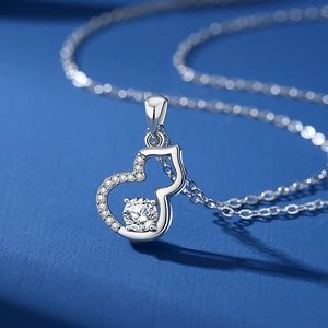 Elegant S925 sterling silver gourd pendant necklace featuring a round moissanite center stone