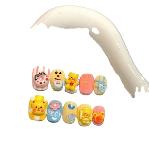 Handmade 3D cartoon bear press-on nails set with vibrant yellow and pink kawaii patterns