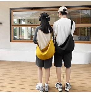 Outdoor lifestyle view of large capacity oxford fabric moon bags in yellow and black