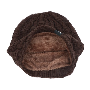 Detailed close-up of thick fleece lining and wave knit texture on dark brown beanie