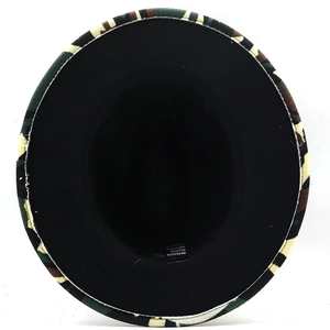 Detail view of camouflage fedora showing cotton polyester fabric labels and black interior