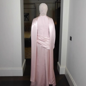 Close-up of pink satin dress back detail with waist pleats and concealed zipper