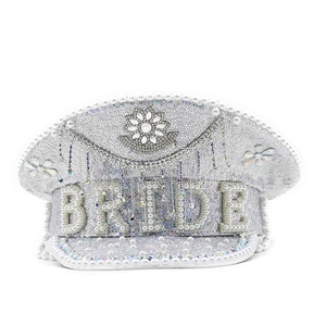 Detail of white sequin bride captain hat with pearl lettering and crystal flower accents