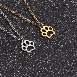 Polished stainless steel dog paw cut-out pendant necklaces in gold and silver finish