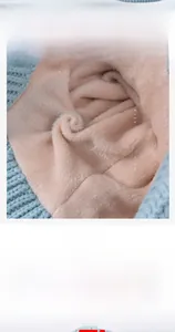 Close-up of thick plush fleece lining in kids winter knit set for warmth and comfort