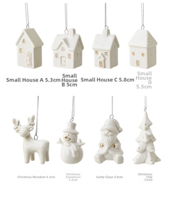 Collection of white ceramic Christmas ornaments with gold details and silver hanging strings