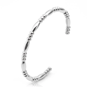 Close-up of silver C-shaped bamboo bead bracelet in polished stainless steel