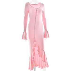 Detail of pink long-sleeve dress with V-neck, front buttons and ruffled fishtail hemline