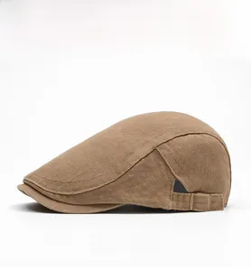 Side view of brown cotton beret featuring metal adjustable buckle and breathable eyelets
