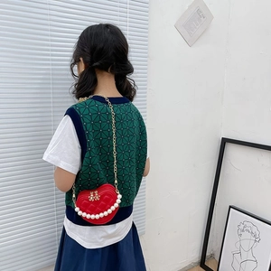 Red quilted heart-shaped crossbody bag with pearl handle and metal chain for girls