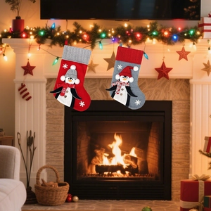 Red and gray Christmas stockings featuring 3D penguins and snowflake embroidery