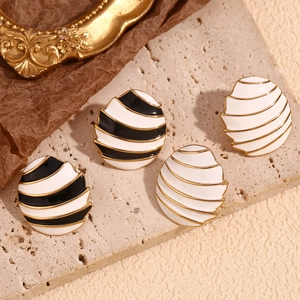 18K gold plated oval sail earrings with black, white striped enamel and gold accents