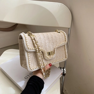 Oatmeal straw woven shoulder bag with white pearl trim and golden chain strap for summer