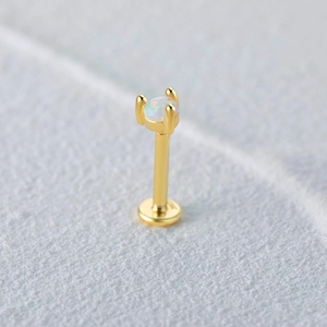 Macro shot of S925 sterling silver stamp on golden opal stud earring base