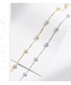 Detail view of 925 sterling silver four-leaf clover bracelets with micro-paved zircons