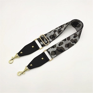 Adjustable leopard print wide shoulder strap with gold metal buckle and pyramid studs
