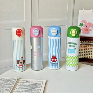 Detail view of four insulated stainless steel bottles with cute cartoon animal patterns