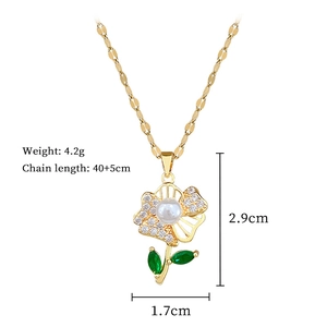 Detail of gold floral pendant with pearls, green stones and technical dimensions