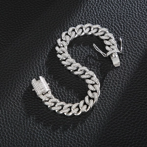 Silver iced-out Cuban link chain bracelet with micro-pave crystals on black leather