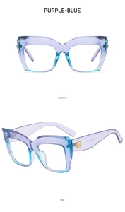 Detail view of purple-blue gradient cat-eye frames with golden hinges and side profile