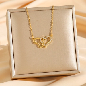 Elegant double interlocking heart necklace in gold finish with white zircon accents