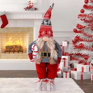 Standing Christmas gnome with deer pattern hat and candy cane for holiday decor