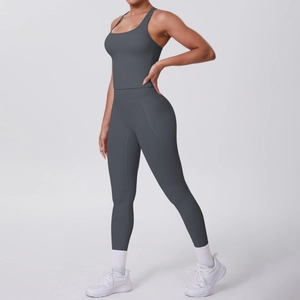 Detail of dark grey yoga set featuring side pockets and high-waist compression leggings