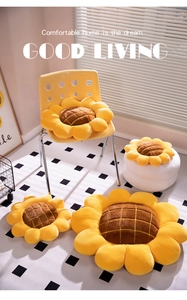 Detail showing different sizes of sunflower floor cushions with soft yellow plush petals