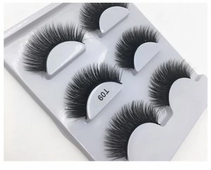 Macro shot of T09 dense criss-cross eyelashes on a professional white storage tray