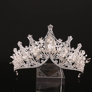 Detailed macro view of silver bridal crown featuring sparkling rhinestones and pearls