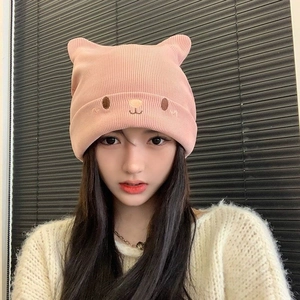 Pink knit cat ear beanie for women featuring cute embroidery and ribbed texture style