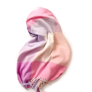 Elegant plaid scarf with pink purple and beige stripes and fringe on white background