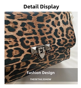 Detail of leopard print shoulder bag with antique silver rivet buckle and chain strap