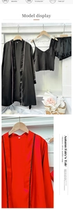 Detail view of smooth satin pajamas set showing silk texture and delicate piping on hem