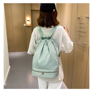 Light green Oxford cloth swim backpack featuring a separate bottom wet-dry compartment