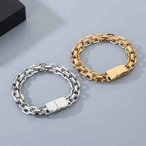 Detailed view of dual-row pig nose chain bracelets in polished gold and silver steel
