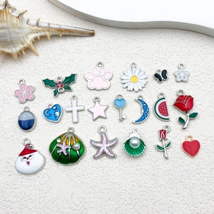 Macro shot of assorted colorful enamel alloy charms for DIY jewelry making and earrings