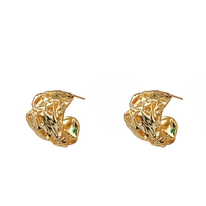 Minimalist C-shaped irregular pleated metal stud earrings in gold with a textured finish