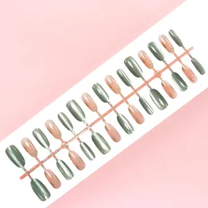 Press-on nail set with green cat-eye and maple leaf designs, includes 30 pieces