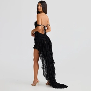 Back view of sexy black lace dress showing open back design and ruffled train detail