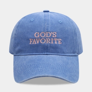 Blue washed cotton baseball cap with pink God's Favorite embroidery on a grey background
