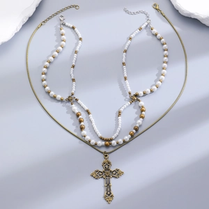 Vintage layered cross pendant necklace with pearls and matte gold finish chains