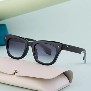 Polarized sports sunglasses in black thick frames with blue gradient lenses and case