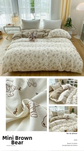 Close-up of soft cotton duvet cover featuring cute brown bear patterns and fabric texture
