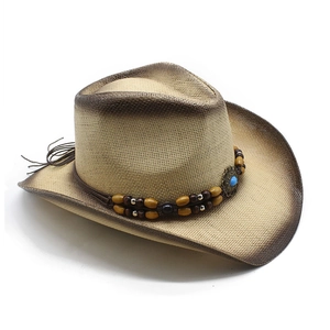 Detail of cowboy straw hat featuring leather band with turquoise stone and wooden beads