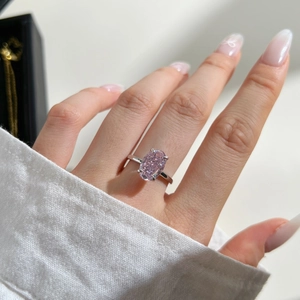 Detail of S925 sterling silver ring with oval pink zircon in four-prong setting