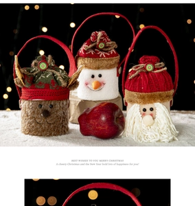 Detailed view of plush Christmas gift bags with reindeer and snowman designs on snow