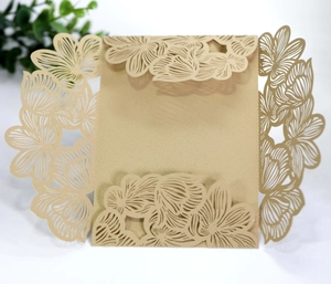 Macro detail of laser-cut gold floral hollow invitation card with pearlescent texture