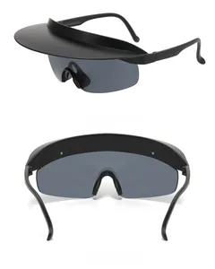 Detail view of black frameless rimless sunglasses with integrated visor and wrap lenses