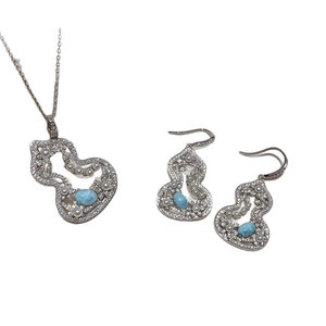 Silver gourd jewelry set with blue gemstones and pearls including necklace and earrings